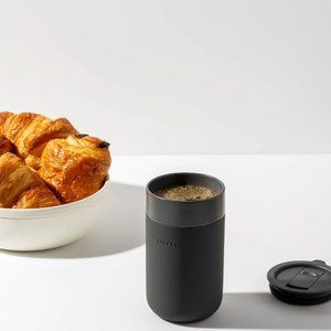 PORTER TO-GO MUG CHARCOAL IN COLOR CERAMIC 16 OZ. MUG WITH A SILICONE SLEEVE